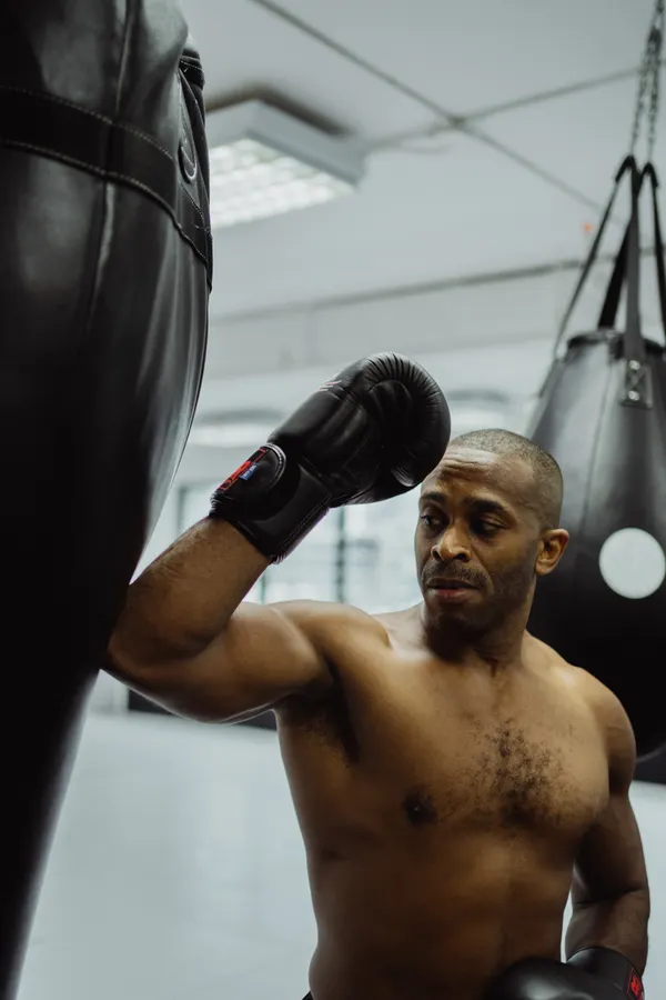 Boxer focused at the heavy bag during training